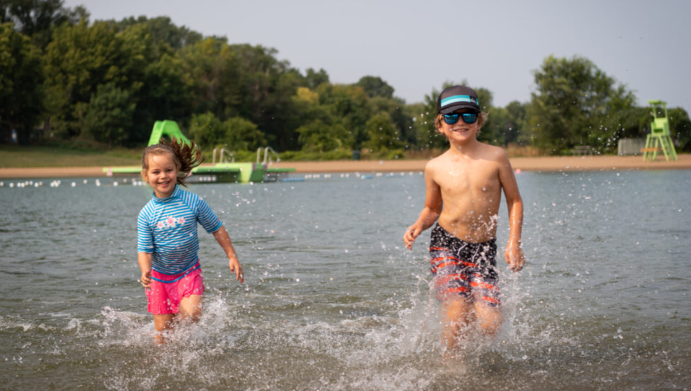 Kids running in water at the beach