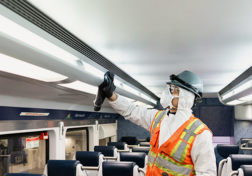 Photo of a person cleaning the inside of an exo train